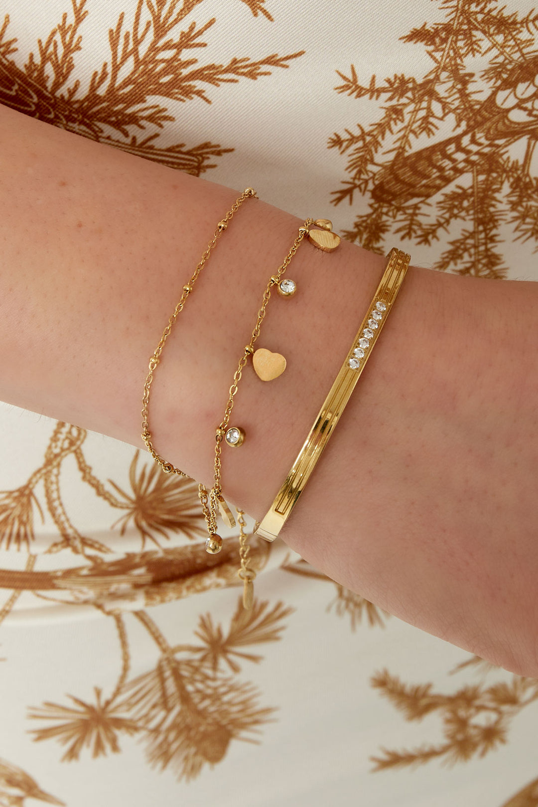 charm bracelet with hearts and diamonds